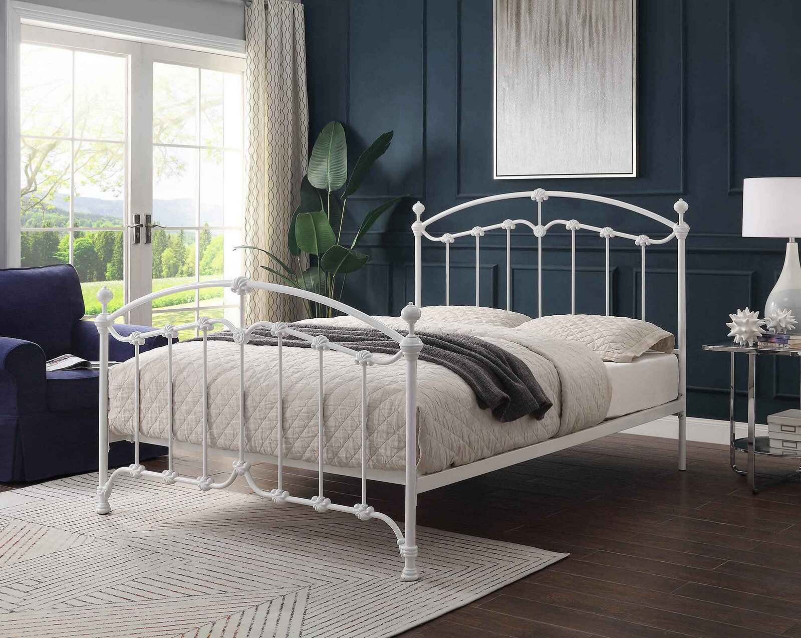 white wrought iron bed and mattress